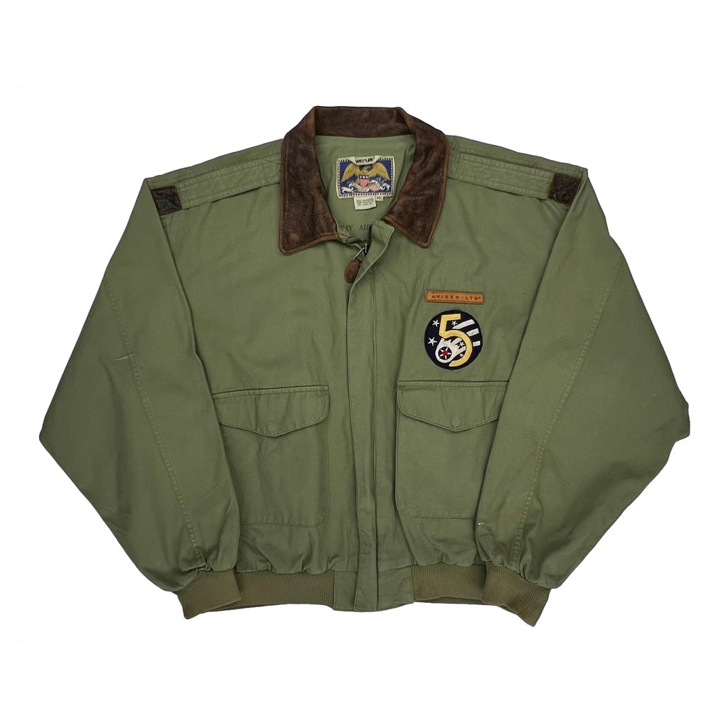 Green jacket with patches on a white background