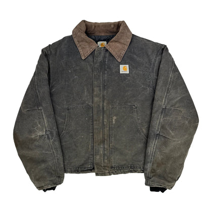 Worn denim jacket with Carhartt logo on a white background